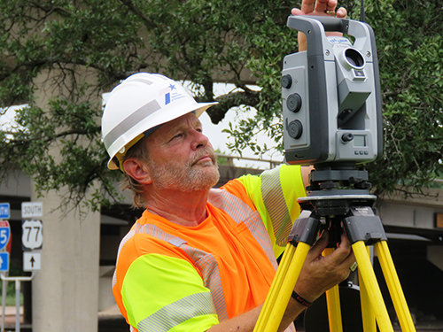 David Hollers sets up the robotic total station