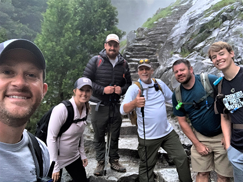 Hikers posing on Half Dome