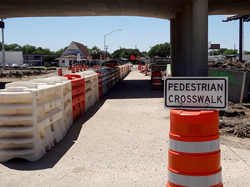 temporary pedestrian crosswalk set up with barricades