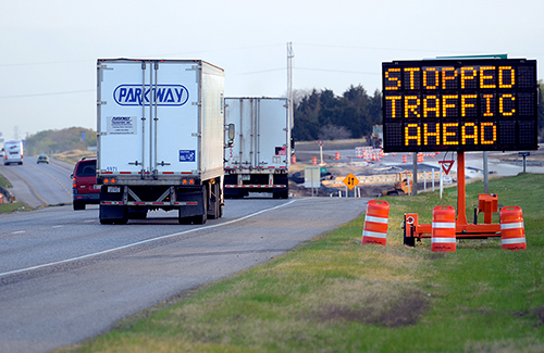 portable message sign displaying, "stopped traffic ahead"