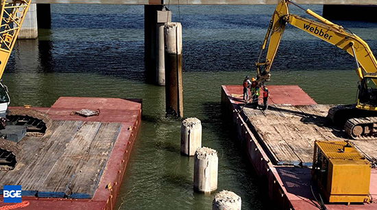 Workers on a barge over the Brazos River